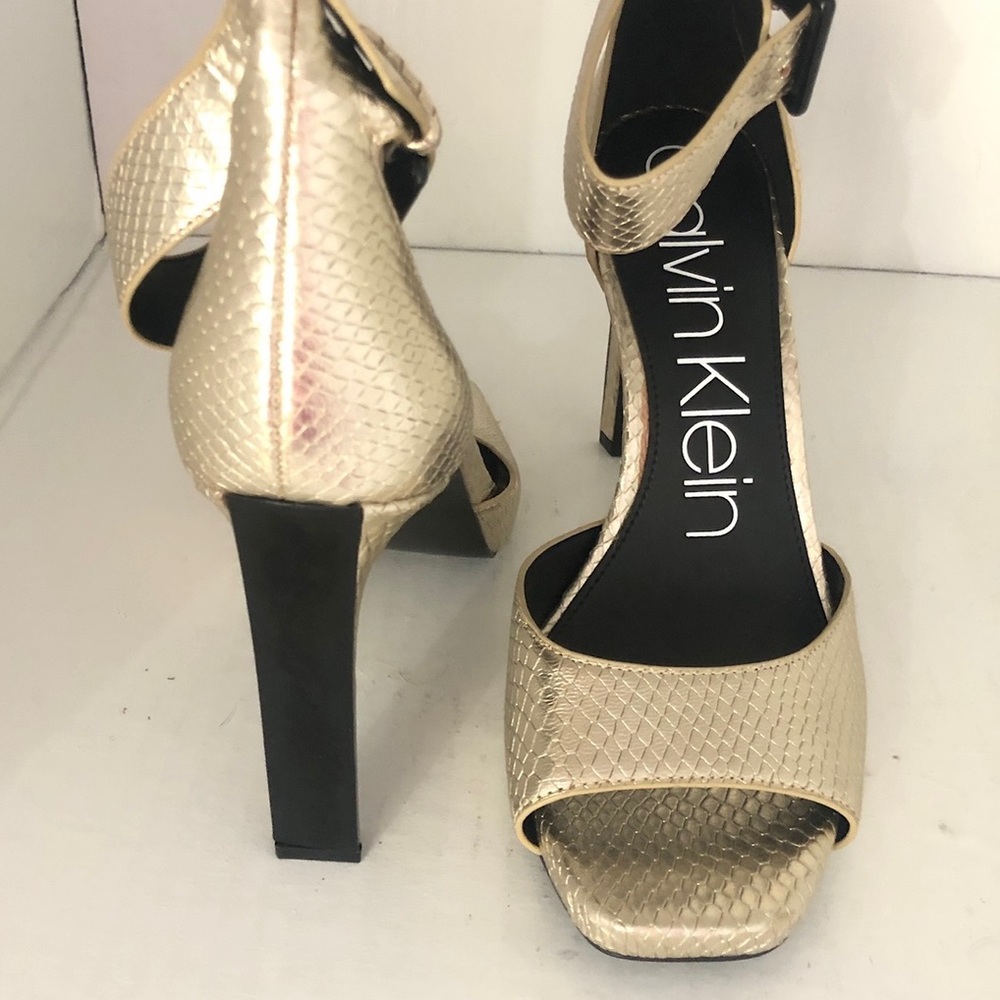 Calvin Klein New gold sandals size 9. Let hear hight heels , new no box !